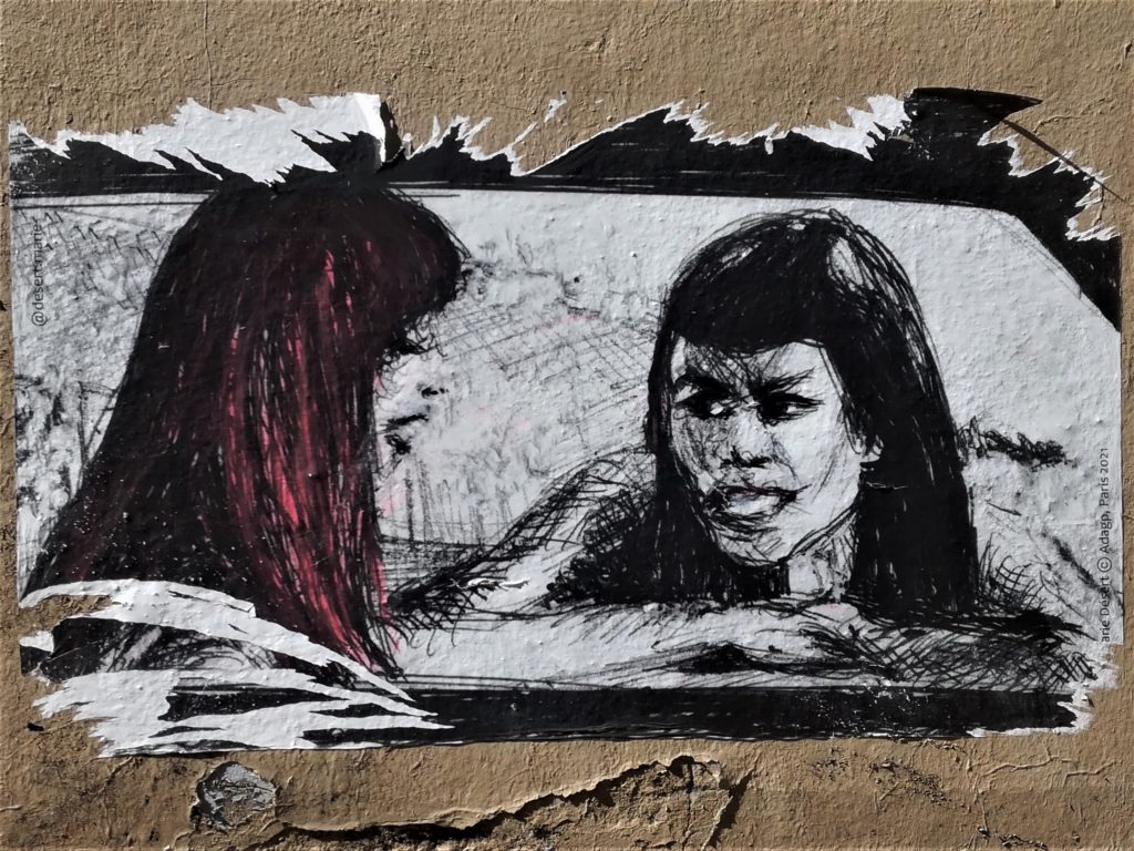 Graffiti représentant deux femmes l'une brune et l'autre aux cheveux rouge